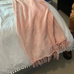 Pink throw blanket with fringe